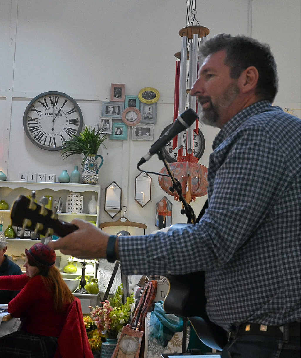 Andrew Kucks plays his acoustic guitar for the patrons of Bryson’s Place.